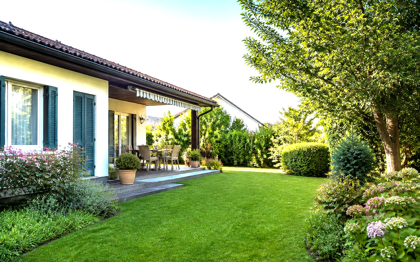 Symbolbild eines Hauses mit Garten